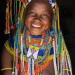 A beautiful smiling Ovamwila woman (image by Inger Vandyke)