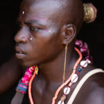 Portrait of a young Taneka man dressed for the initiation ceremony in a remote village in the Atacora foothills (image by Ingrid Koedood)