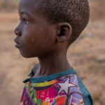A young Taneka boy with the facial scarification that links him to Taneka people (image by Ingrid Koedood)