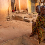 Beautiful identically dressed twin boys in remote Benin (image by Ingrid Koedood)