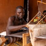 Traditional weaver at work in the palace of Agonglo in Abomey (image by Ingrid Koedood)
