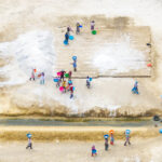 Women carry salt to mounds at a mine in southern Angola (image by Inger Vandyke)