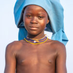 A young Ovakuvale girl wearing a baby Ompota headdress (image by Inger Vandyke)