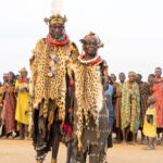 Toposa women attend a dance wearing ceremonial Serval skins (image by Inger Vandyke)