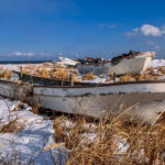 Fishing boats - tied up for the winter - pepper the snowy shores of the Notsuke Peninsula, and can make interesting subjects for photographers (image by Virginia Wilde)