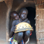 Laarim children at the door of their home in the Kimotong Mountains (image by Inger Vandyke)