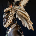 Sikirate adornment is traditionally used at funerals. Made from human hair, cowrie shells and ostrich feathers, it is the spectacular decoration of Lopit warriors (image by Inger Vandyke)