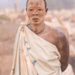 Mundari men cover their skin in fire ash, like their cows, to protect themselves from the sun while they take their cows to graze (image by Inger Vandyke)