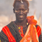 A Mundari man with his trademark 'V' forehead scars (image by Inger Vandyke)