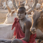 A Mundari man with his face covered in ash (image by Inger Vandyke)