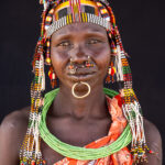 Regally decorated Toposa woman (image by Inger Vandyke)