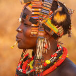 Toposa decoration is multi-faceted and often involves piercings, silver jewellery, bead work and animal skins (image by Inger Vandyke)