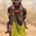 Toposa children grow up in the care of their decorated mothers (image by Inger Vandyke)