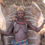 Toposa woman and Kudu skin (image by Inger Vandyke)