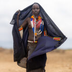 A young Arbore woman, her shawl flowing in the wind (image by Ingrid Koedood)