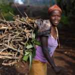 A woman from the Ari tribe carrying a bundle of wooden sticks on her back. She was friendly and, despite the weight, she took time for a photo (image by Ingrid Koedood)