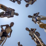 Captures the Benna boys on their stilts, with me lying on the ground to get the perfect shot. It looks easier than it actually is, one of the boys fell on me (image by Ingrid Koedood)