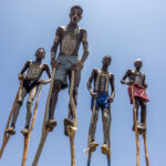 Originally, the stilts were used to avoid being attacked by wild animals. Today, the Benna boys use them for tourists (image by Ingrid Koedood)