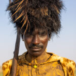 Portrait of a Dassanech man covered in yellow ochre and wearing a leopard skin to celebrate Dimi ceremony (image by Ingrid Koedood)