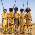Decorated Dassanech men covered in leopard skin and yellow ochre to celebrate Dimi ceremony (image by Ingrid Koedood)