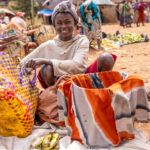 A portrait of a friendly young woman at the Dorze market trying to sell her goods (image by Ingrid Koedood)