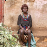 This young Hamer woman at the Turmi market wears the ‘Bignere’ necklace, a symbol of marriage. Her necklace, without the metal extension, reveals that she is a wife but not the first (image by Ingrid Koedood)