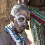 A portrait of a Maza (the whipper) with a painted face preparing for his role in the event during the bull jumping ceremony (image by Ingrid Koedood)