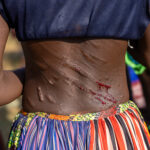Part of de bull jumping ceremony is that Hamer women (female relatives) beg Hamar men (called Maza) to whip them to show they are strong to be potential wives (image by Ingrid Koedood)