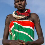 A beautiful Karo woman with scarification on her arms (image by Ingrid Koedood)