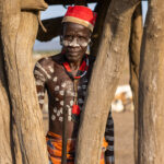 A Karo man standing inside a wooden structure called Marmar, reserved strictly for men (image by Ingrid Koedood)