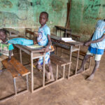 Young boys in a classroom in Kibish, where resources are scarce and they rely heavily on donations to support their education (image by Ingrid Koedood)