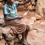 An elder woman in a Konso village skilfully spins coton (image by Ingrid Koedood)
