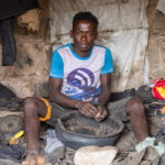 A man demonstrates the art of making sandals from recycled car tires in Konso. The sandals cost 500 ETB (around US$4), expensive for most local people but they last a lifetime (image by Ingrid Koedood)