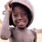 A young Nyangatom boy carries a calabash on his head, traditionally used for drinking (image by Ingrid Koedood)