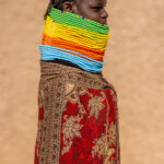 Portrait of a young Nyangatom woman adorned with countless colorful necklaces (image by Ingrid Koedood)