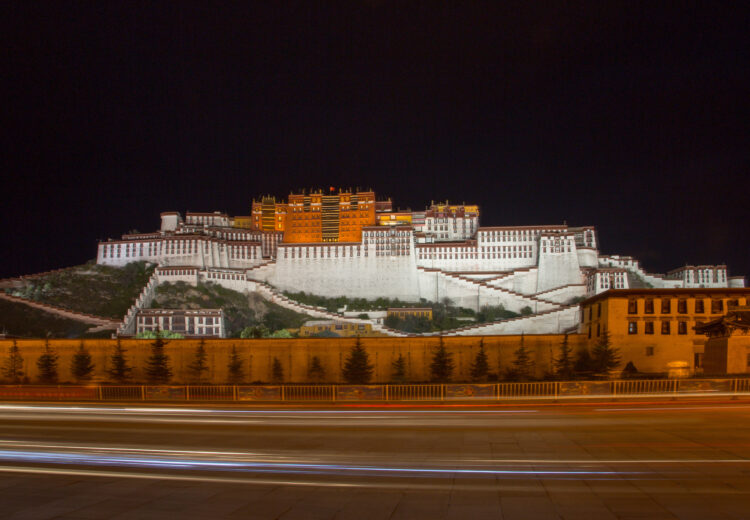 Practicing slow shutter photos of the traffic driving past the Potala in the evening (image by Inger Vandyke)