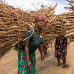 On our tour, there was plenty of time to stop whenever we spotted something interesting, like these women carrying heavy branches on their backs (image by Ingrid Koedood)