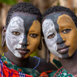 Two Suri girls with painted faces (image by Ingrid Koedood)