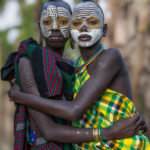 The Suri practice the art of body painting. Different clays are collected ranging from red, orange, yellow and white. They are mixed with a little water and painted onto face and body (image by Ingrid Koedood)