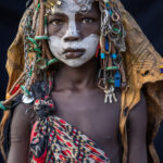 A young Suri girl with spectacular decoration (image by Ingrid Koedood)