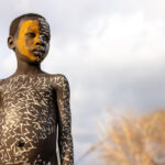 A young painted Suri boy (image by Ingrid Koedood)