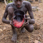 A young Suri boy with fresh cow’s blood as breakfast (image by Ingrid Koedood)