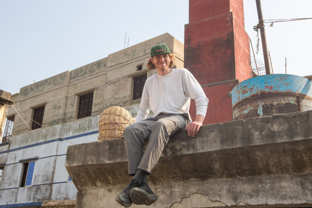 Alexander enjoying the rice drying courtyards from the roof of a nearby building (image by Yousuf Tushar)