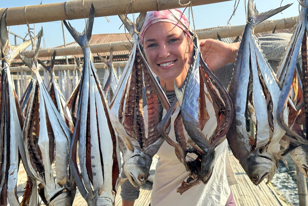 Bria smiles in the fish drying yards of Bangladesh (image by Yousuf Tushar)