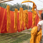 Drying pieces of marigold coloured cloth in rural Bangladesh (image by Yousuf Tushar)