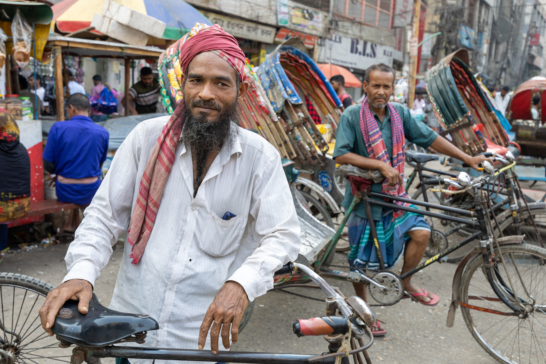 The ever friendly and brave cycle rickshaw drivers in Dhaka (image by Yousuf Tushar)