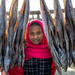 Young girl in the fish drying yards (image by Yousuf Tushar)