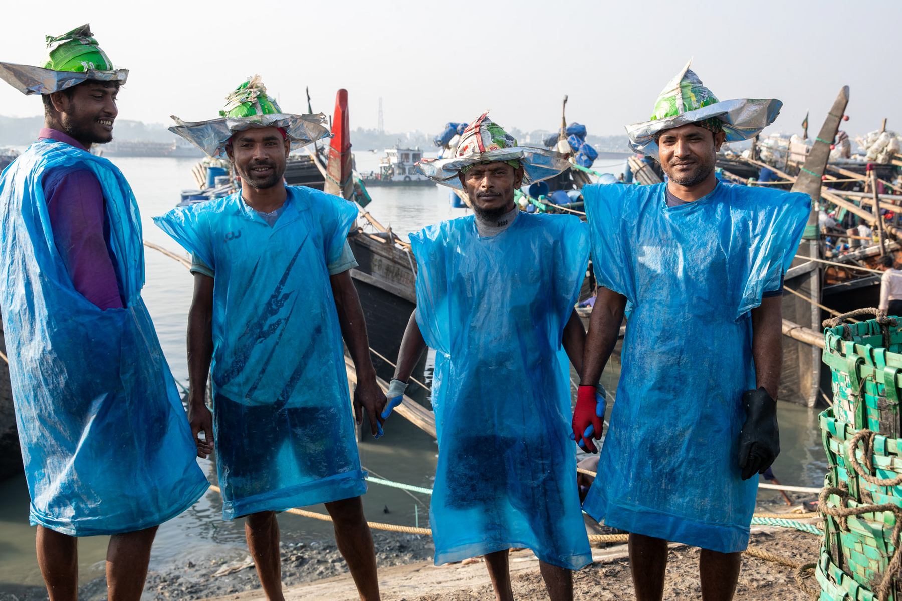 Fish carriers take a brief moment to stop for a photo (image by Yousuf Tushar)