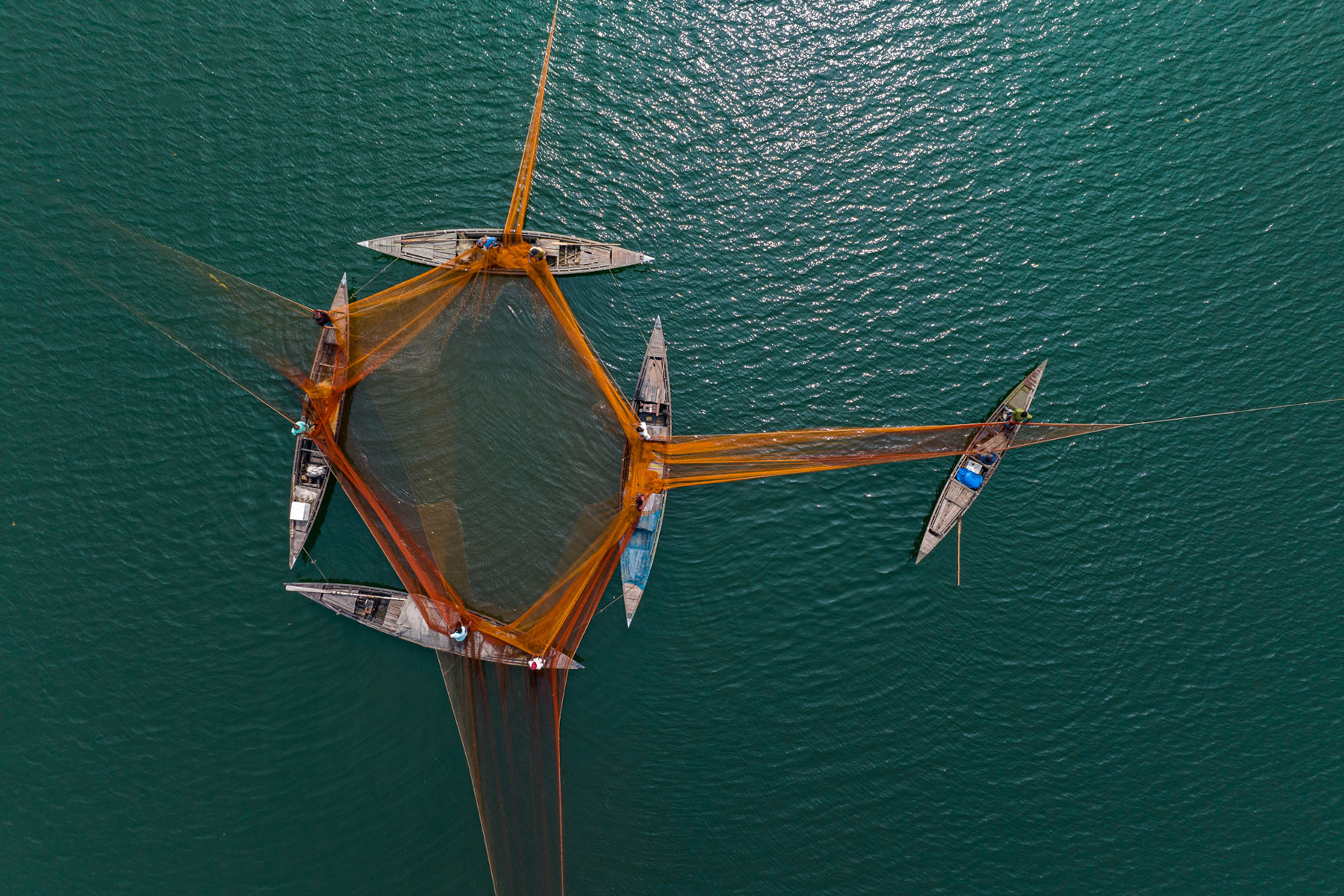 View of a four-boat fishing operation with the fifth boat acting as a lead vessel (image by Yousuf Tushar)