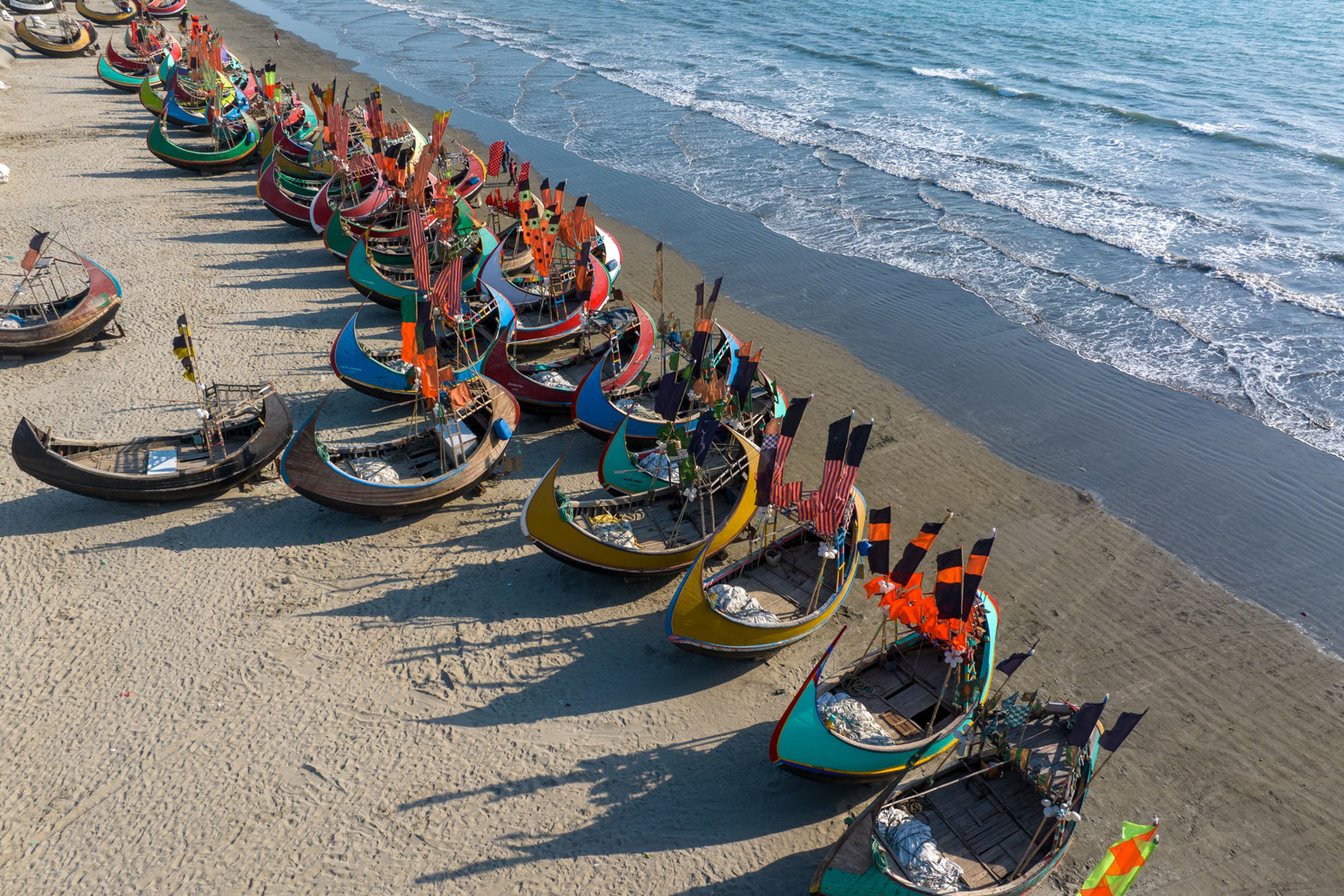 Aerial view of Bangladesh's stunning moon boats lining the high tide mark at Cox's Bazaar (image by Yousuf Tushar)